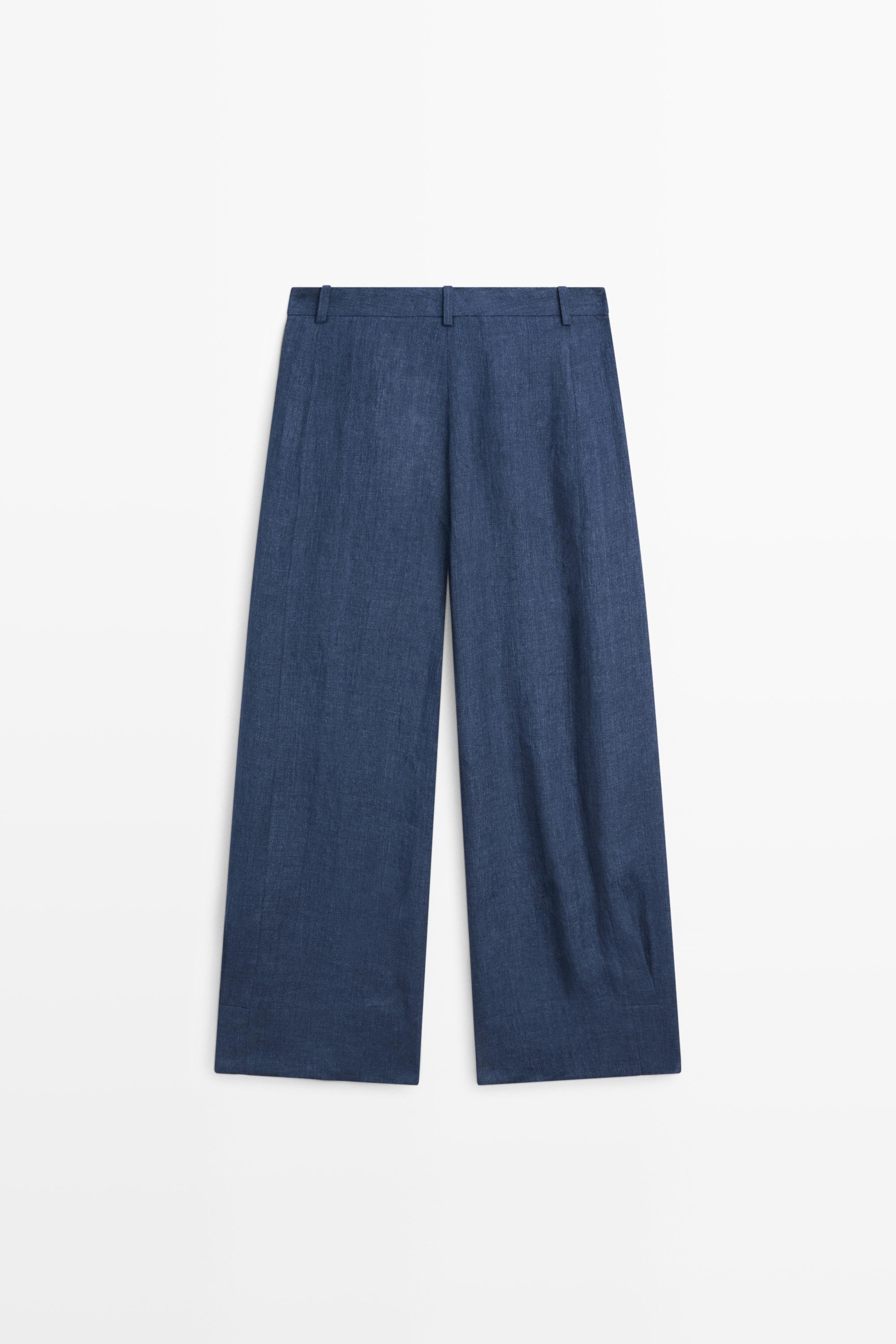 Total look linen pants with buttoned hems
